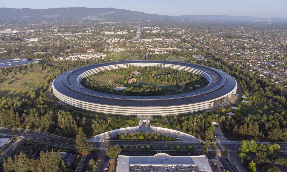 A circular building with inner landscaping known as Apple Park or the spaceship that sits inside Silicon Valley.